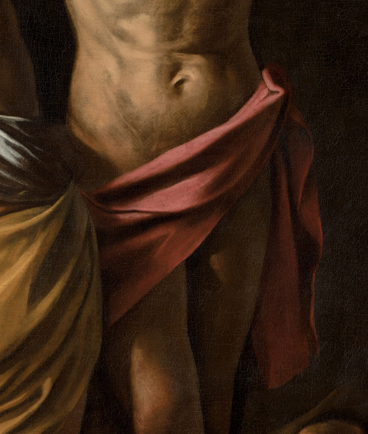 Détail du Crucifiement de saint André (Caravage) : torse émacié du saint, linge rose-rouge et étoffe ocre à gauche